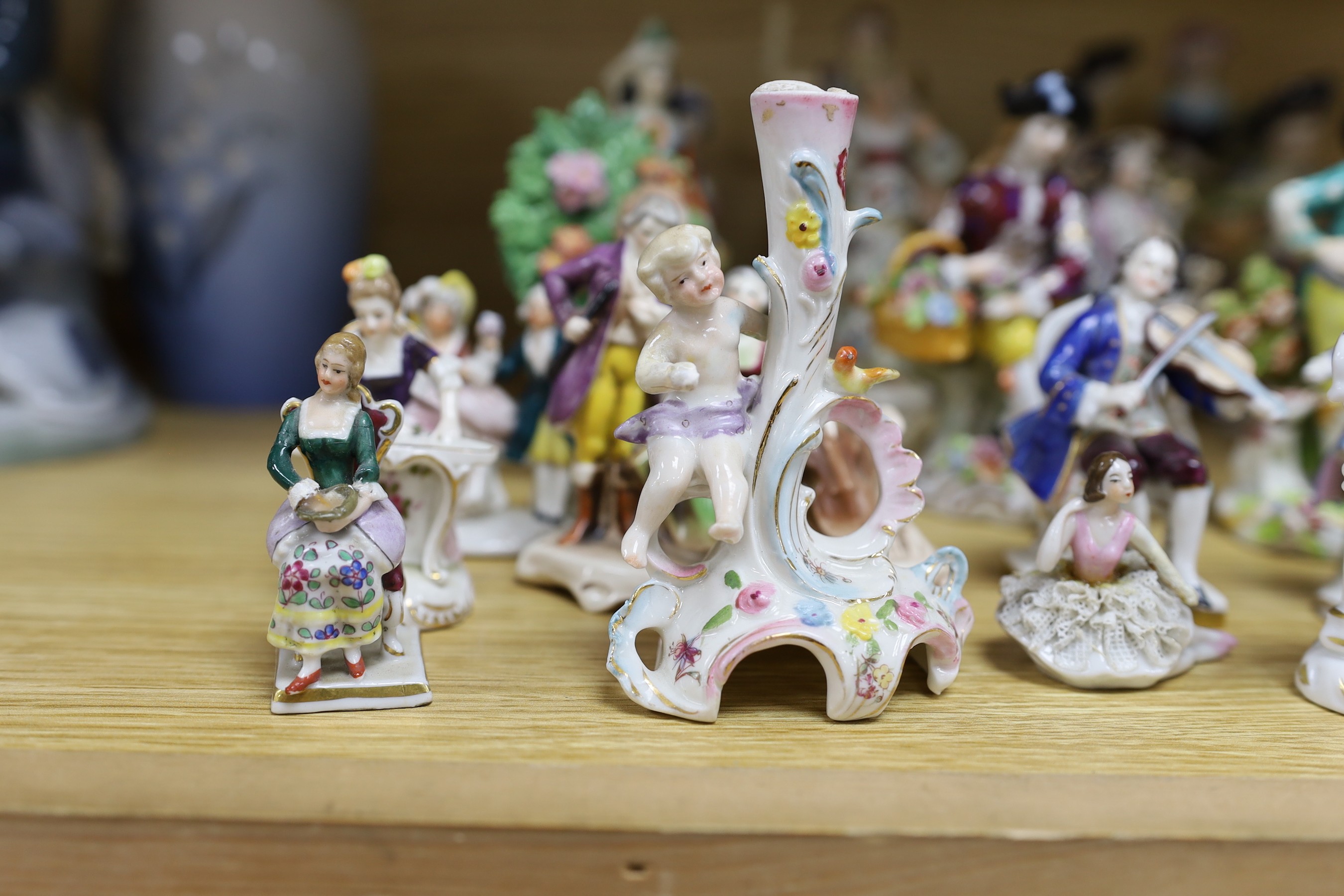 A group of small continental porcelain figures, to include Dresden and others